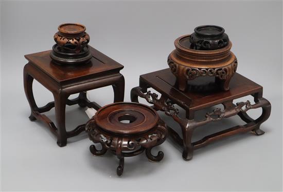 Seven various Oriental hardwood stands